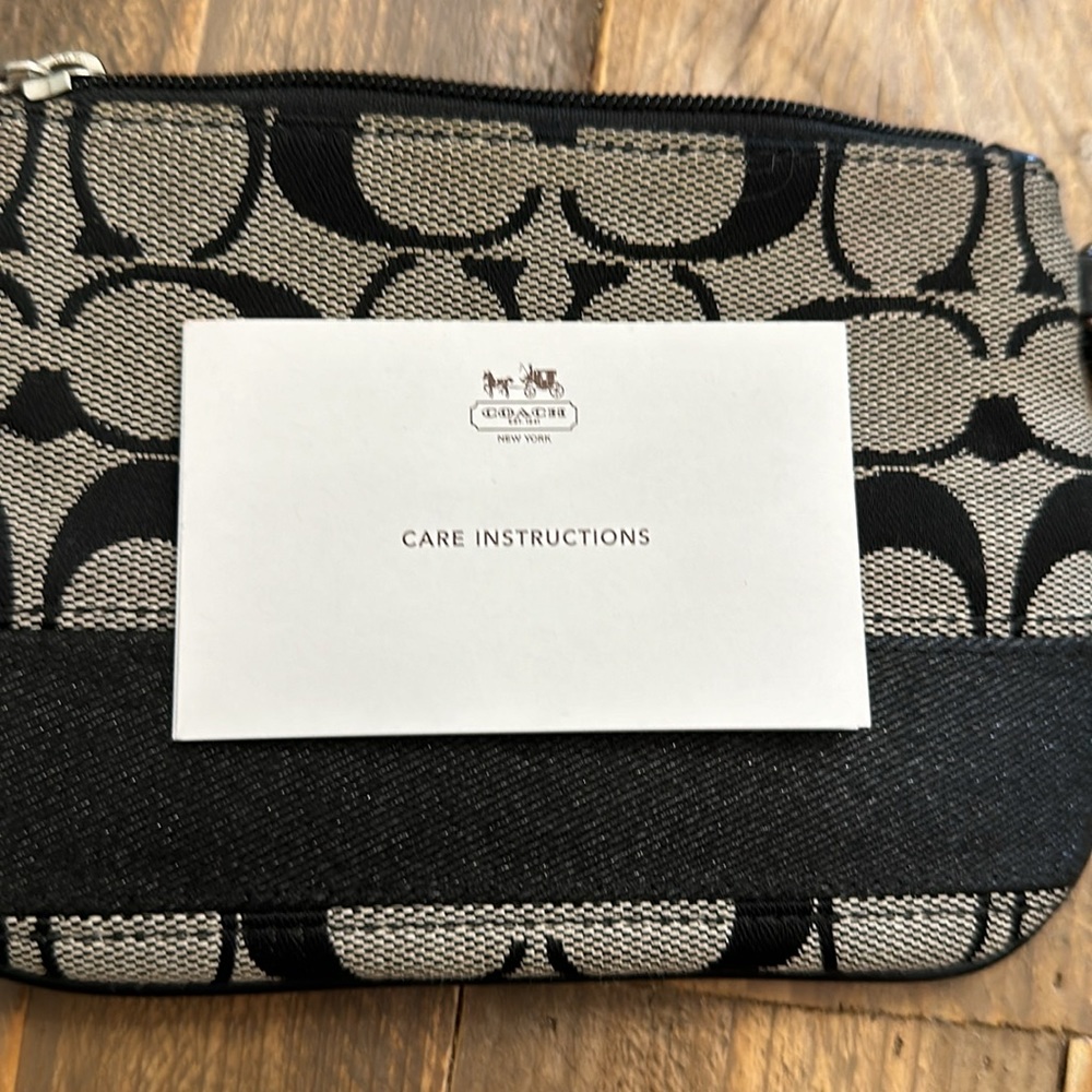 Coach black and grey signature small wristlet-excellent used condition